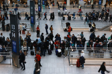 People move through the Moynihan Train Hall on Dec. 18, 2025, in New York City, US. The Labor Department reported Thursday that Inflation unexpectedly slowed in November, with the consumer price index rising 2.7% in November from a year earlier.