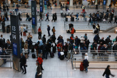 People move through the Moynihan Train Hall on Dec. 18, 2025, in New York City, US. The Labor Department reported Thursday that Inflation unexpectedly slowed in November, with the consumer price index rising 2.7% in November from a year earlier.