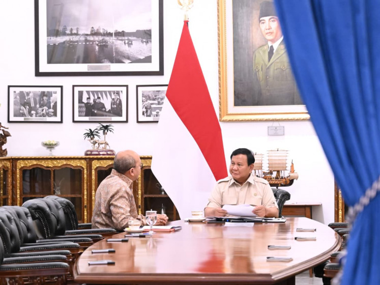 Investment Minister and CEO of state asset fund Danantara, Rosan Roeslani (left), talks with President Prabowo Subianto during a meeting  on Dec. 17, 2025, at the Merdeka Palace in Jakarta about the progress of land acquisition for the haj village project in Mecca, Saudi Arabia. The project is expected to provide better services for Indonesian haj and 'umrah' (minor haj) travelers during their pilgrimage. 