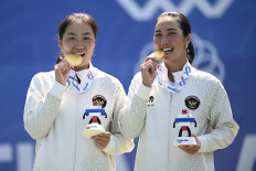 Golden girls: Indonesian women&rsquo;s doubles tennis players Janice Tjen (left) and Aldila Sutjiadi pose with their gold medals on Dec. 19, 2025, after the award ceremony for the 2025 Southeast Asia (SEA) Games women&rsquo;s doubles final at the National Tennis Development Center in Pak Kret, Nonthaburi, Bangkok. Aldila and Janice won after defeating Thailand&rsquo;s Peangtarn Plipuech and Mananchaya Sawangkaew 2-0 (6-2, 6-1).