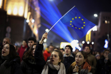 People gather to demonstrate after parliament opposition urged more protests after the government collapsed in a tax dispute, Sofia, Bulgaria, December 18, 2025. 