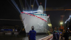 Workers pull the newly named and launched KRI Balaputradewa-322 out of the Orca graving dock on Dec. 19, 2025, at state-owned shipyard PT PAL Indonesia in Surabaya. KRI Balaputradewa is the first of two frigates using the Arrowhead 140 design from British shipyard Babcock International.