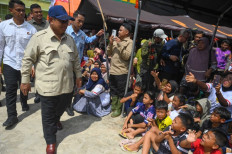Facing reality: President Prabowo Subianto (third left), accompanied by North Sumatra Governor Bonny Nasution (second left), greets evacuees at a shelter for victims of flash floods at MAN 1 Islamic senior high school in Tanjung Pura, Langkat regency, North Sumatra, on Dec. 13, 2025.