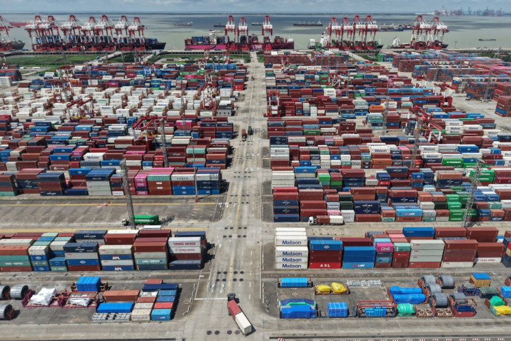 Pile it up: Stacks of containers are seen during routine export and import operations at the Shanghai International Port in China on Nov. 7, 2025.