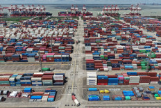 Pile it up: Stacks of containers are seen during routine export and import operations at the Shanghai International Port in China on Nov. 7, 2025.