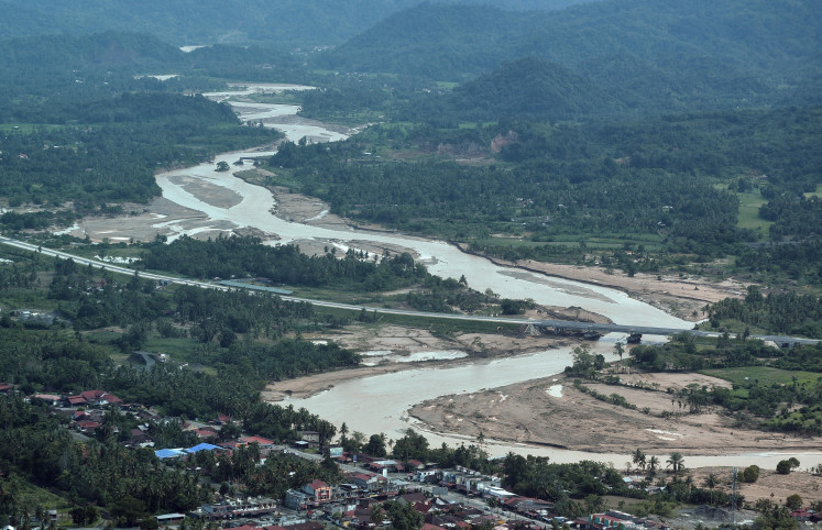 Flood fury: Riverbank areas affected by flash floods are seen on Dec. 21, 2025, in Padang Pariaman, West Sumatra. 