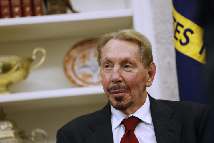Oracle co-founder, CTO and executive chairman Larry Ellison listens as US President Donald Trump speaks to reporters in the Oval Office of the White House on Feb. 03, 2025 in Washington, DC.