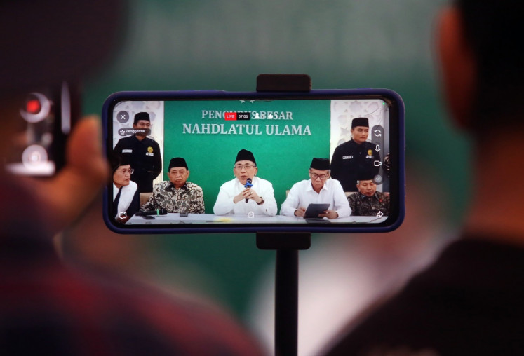Indonesia&rsquo;s largest Islamic organization Nahdlatul Ulama (NU) chairman Yahya Cholil Staquf (center), accompanied by the organization&rsquo;s deputy chairman Masyhuri Malik (second left) and secretary-general Amin Said Husni (second right), gives a press statement on Dec. 3, 2025, regarding the refusal to step down as chairman in Jakarta. 