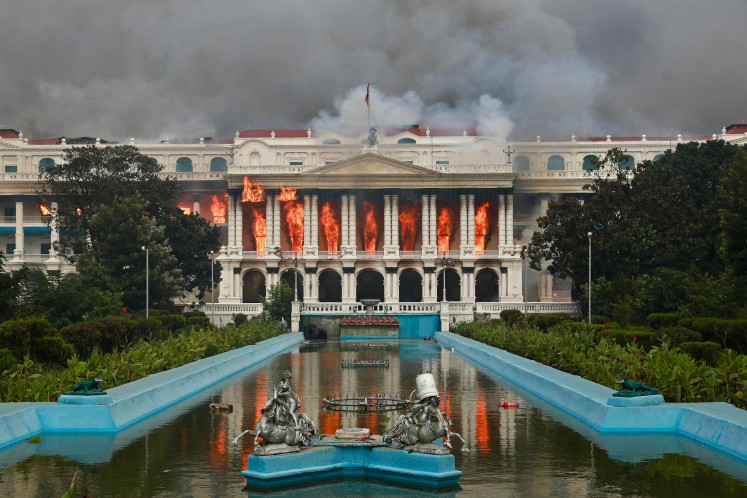 Fire rages through Singha Durbar in Kathmandu during a Gen Z protest on Sept. 9, 2025, a day after a police crackdown on demonstrations over a ban on 26 social media platforms and alleged government corruption. 