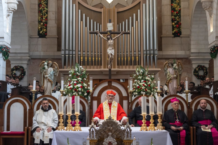 Latin Patriarch of Jerusalem Italian Pierbattista Pizzaballa (center) leads the yearly Christmas mass in the Church of the Nativity in the Israeli-occupied West Bank city of Bethlehem, believed to be the birthplace of Jesus Christ, on Dec. 24, 2025. Throughout the Gaza war that began with Hamas's attack on Israel in October 2023, a sombre tone marked Chistmases in Bethlehem, the biblical birthplace of Jesus Christ.