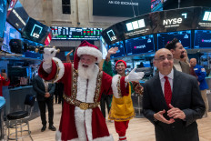 With holiday festivities officially beginning in New York with the Thanksgiving Day Parade on Thursday, Santa Claus and elves visited the New York Stock Exchange (NYSE) on Nov. 26, 2025, in New York City, US.