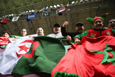 Algeria supporters cheer with flags ahead of the Africa Cup of Nations (CAN) Group E football match between Algeria and Sudan at Moulay Hassan Stadium in Rabat, Morocco on Dec. 24, 2025.