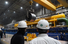 Krakatau Steel employees watch the production of the first hot rolled coil (HRC) steel on May 17, 2021, in the company's second hot steel mill in Banten. (Courtesy of Krakatau Steel) 
