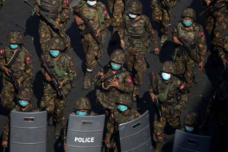 Myanmar soldiers from the 77th light infantry division walk along a street during a protest against the military coup in Yangon, Myanmar in this file photo taken on Feb. 28, 2021. Myanmar will hold a third phase of voting for its general election on Jan. 25, 2026, according to an announcement on state media amid a raging civil war. The junta regime plans to hold a ballot beginning Dec. 28, 2025.