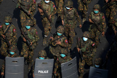 Myanmar soldiers from the 77th light infantry division walk along a street during a protest against the military coup in Yangon, Myanmar in this file photo taken on Feb. 28, 2021. Myanmar will hold a third phase of voting for its general election on Jan. 25, 2026, according to an announcement on state media amid a raging civil war. The junta regime plans to hold a ballot beginning Dec. 28, 2025.