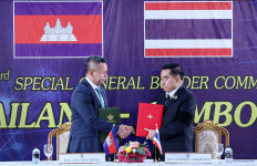 Cambodia&rsquo;s Defense Minister Tea Seiha (left) and his counterpart Thailand Defense Minister Nattaphon Narkphanit shake hands and exchange documents during a meeting in Chanthaburi province, Thailand, in this handout photo released by Agence Kampuchea Press (AKP) on Dec 27, 2025. Cambodia and Thailand agreed to an &ldquo;immediate&rdquo; ceasefire on Saturday, the two countries said in a joint statement, pledging to end weeks of deadly border clashes.