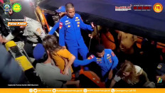 Rescue teams help to depart the rescued, as the National Search and Rescue Agency (Basarnas) said, after a boat carrying several people sank off the coast of Labuan Bajo in extreme weather, Spanish authorities and an Indonesian news agency said, in this screengrab from the video obtained by Reuters on Dec. 27, 2025.