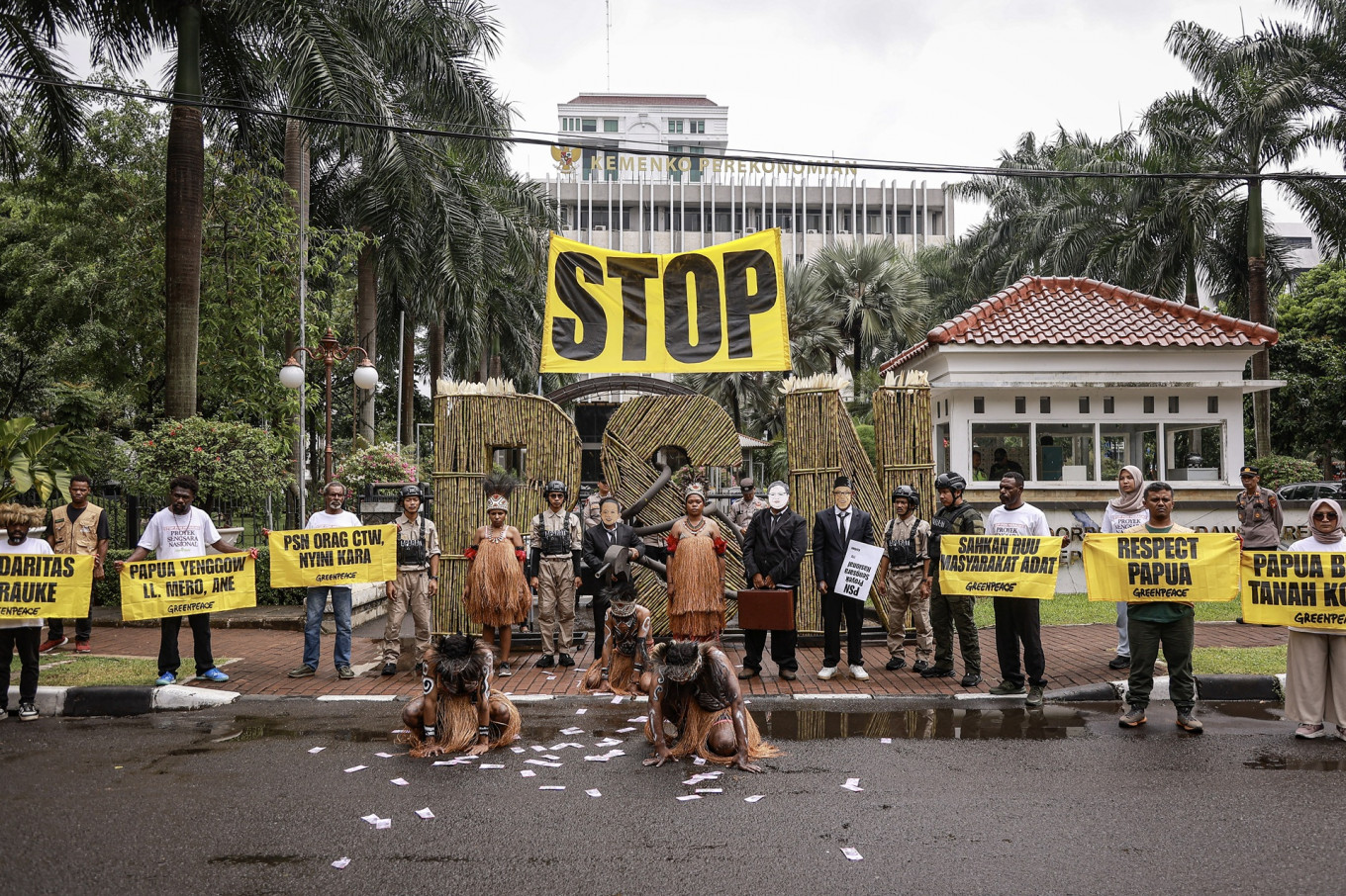 Environmental activists with Greenpeace Indonesia and members of Papuan indigenous communities hold a rally in front of the Office of the Coordinating Economy Minister in Jakarta on Dec. 18, 2025, protesting the national strategic project (PSN) to open a sugarcane plantation in Merauke that they said could cause massive deforestation in Indonesia's easternmost region.