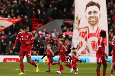 The sons of Liverpool's late Portuguese forward Diogo Jota, Dinis and Duarte and other family members take part in pre-game activities to honor the player who represented both Wolves and Liverpool in the Premier League, ahead of kick-off in the English Premier League football match between Liverpool and Wolverhampton Wanderers at Anfield in Liverpool, England, on Dec. 27, 2025. Father of three Jota died alongside his brother after a Lamborghini they were travelling in came off the road and burst into flames in northern Spain in July.