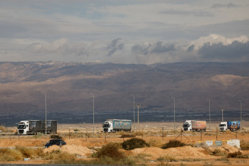Trucks carrying goods from Jordan move near the Allenby Bridge Crossing between the West Bank and Jordan after it was reopened, in the Israeli-occupied West Bank, on Dec. 10, 2025. The UN says the crossing is a major route for bringing food, tents and other goods into Gaza.