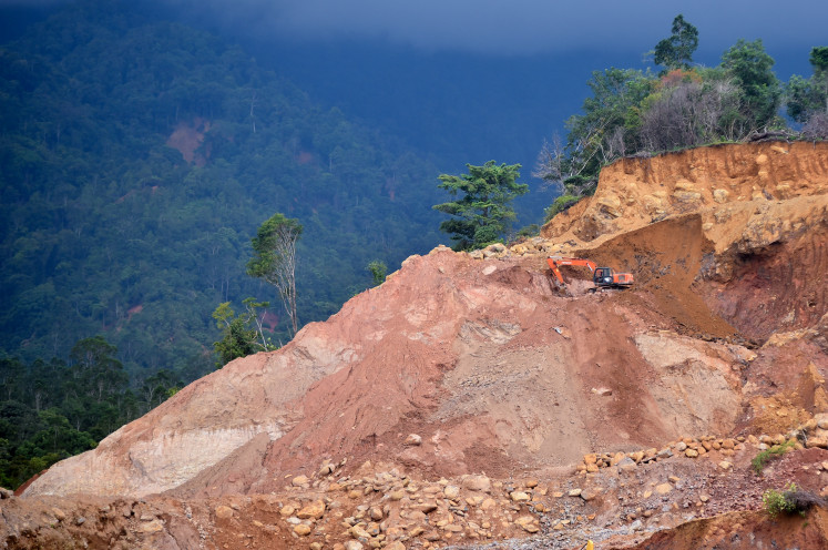 Hole in a hill: A worker operates heavy equipment on Dec. 30, 2025, at a sand and gravel mining site in Gunung Sarik area in Padang, West Sumatra. Environmental group Walhi West Sumatra has called for a permanent halt to all sand and gravel mining activities in the area, saying they are a major contributor to damage to the Kuranji River, and increase the risk of ecological disasters, including flash floods downstream.