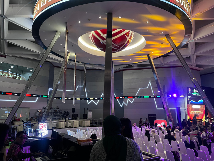 People gather in the main hall of the Indonesia Stock Exchange (IDX) in Central Jakarta as the bourse closes 2025 trade on Dec. 30.