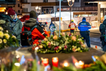 Police control access to the street where a fire ripped through a crowded bar during New Year's Eve celebrations in the Alpine ski resort town of Crans-Montana on Jan. 1, 2026. Several dozen people are presumed dead and around 100 injured after a fire ripped through a crowded bar in the luxury Swiss ski resort of Crans-Montana, Swiss police said on Jan. 1.