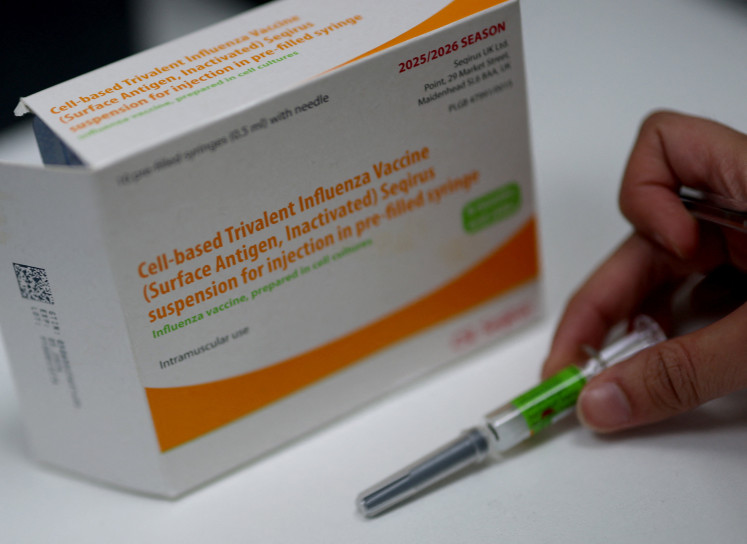 An influenza vaccine box is displayed at a pharmacy as hospitalizations rise, on Dec. 11, 2025, in London, the United Kingdom, with Europe and other regions grappling with a severe flu season and health authorities warning of increasing cases driven by a mutated strain of the virus.