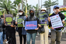 Activists hold a protest against the new Criminal Code (KUHP) on Dec. 5, 2022, outside the Senayan legislative complex in Central Jakarta . The House of Representatives passed on Dec. 6 a revision to the Criminal Code that would outlaw pre-marital sex aside from other sweeping changes to the criminal code, a move critics deemed as a setback to the country's freedoms.