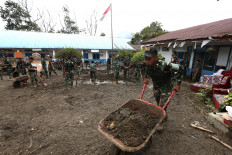 A group of soldiers assist in a post-disaster cleanup operation on Jan. 1, 2026, at SDN 9 Kebayakan state elementary school in Central Aceh, Aceh. Most schools across the province, as well as in North Sumatra and West Sumatra, are expected to reopen on Jan. 5 for the second semester following the severe floods and landslides in November 2025 triggered by Tropical Cyclone Senyar.