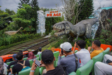 Adrenaline rush: Tourists enjoy a mini roller coaster on Sunday, Jan. 4, 2026, at Jawa Timur Park 3 in Batu, East Java. 