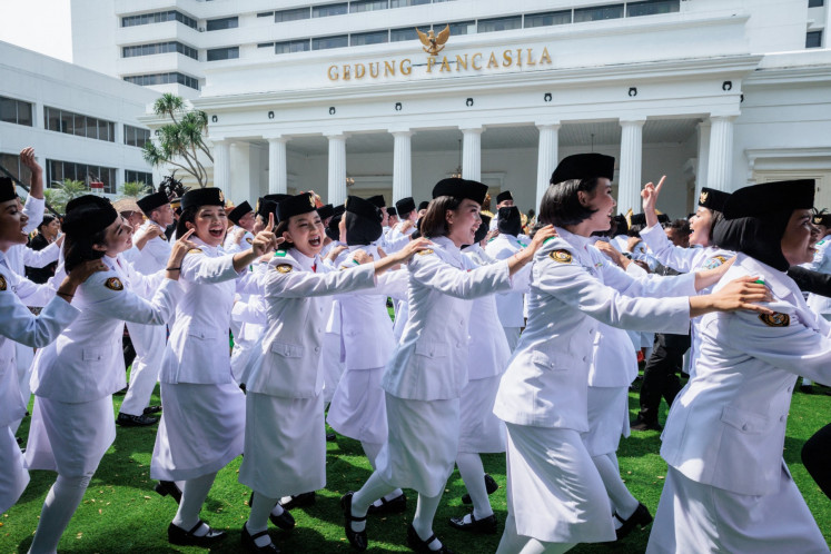 Members of the National Flag Hoisting Troop dance after the commemoration of Pancasila Day at the Pancasila Building, a historic hall within the Foreign Ministry  compound in Jakarta, on June 2, 2025. 