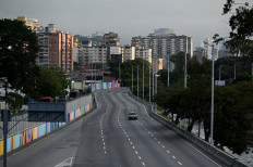 Caracas limbo: A car drives on an empty street on Jan. 3, 2026 after United States President Donald Trump said the US has struck Venezuela and captured its president, Nicolas Maduro, in Caracas.