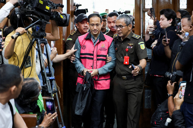 Drowning in scandal: Former education minister Nadiem Makarim, also a cofounder of ride-hailing firm Gojek, arrives on Jan. 5 for his trial in an alleged corruption case on his involvement in the procurement of Google&rsquo;s Chromebook laptops for use at his ministry and by students, at the Jakarta Corruption Court.