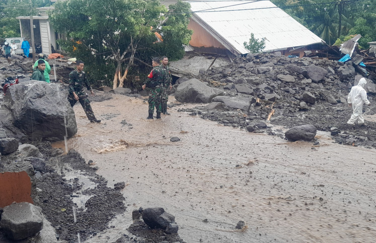 Rescue teams assisted by local residents conducted a search for flash flood victims on Jan. 5, 2026, in Sitim District, Sitaro Island, in North Sulawesi. At least 16 people were killed and 18 others injured after heavy rain triggered flash floods on the island.