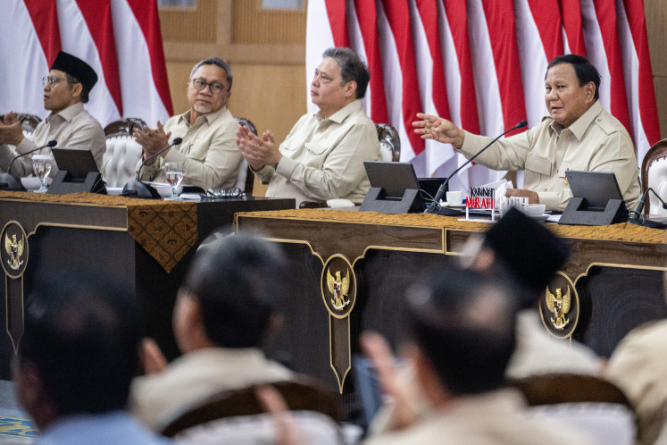 President Prabowo Subianto (right), accompanied by Coordinating Economy Minister Airlangga Hartarto (second right), Coordinating Food Minister Zulkifli Hasan (second left) and other cabinet members, delivers remarks on Jan. 6, 2026, during a New Year briefing in Hambalang, Bogor, West Java.