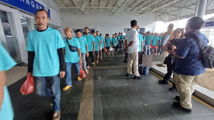 Indonesian migrant workers deported from Johor Bahru, Malaysia, arrive at the Batam Center International Ferry Terminal in Batam, Riau Islands, on Jan. 8, 2026. The Indonesian Consulate General in Johor Bahru, Malaysia facilitated the repatriation of 163 Indonesians, including two children.