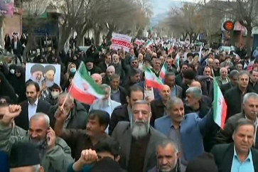 This grab taken from handout video footage released by Iran Press on Jan. 9, 2026, shows pro-government demonstrators chanting slogans as they march along a main street in Khorramabad, western Iran. Iran's supreme leader insisted on Jan. 9 that the Islamic republic would &ldquo;not back down&ldquo; in the face of protests after the biggest rallies yet in an almost two-week movement sparked by anger over the rising cost of living.