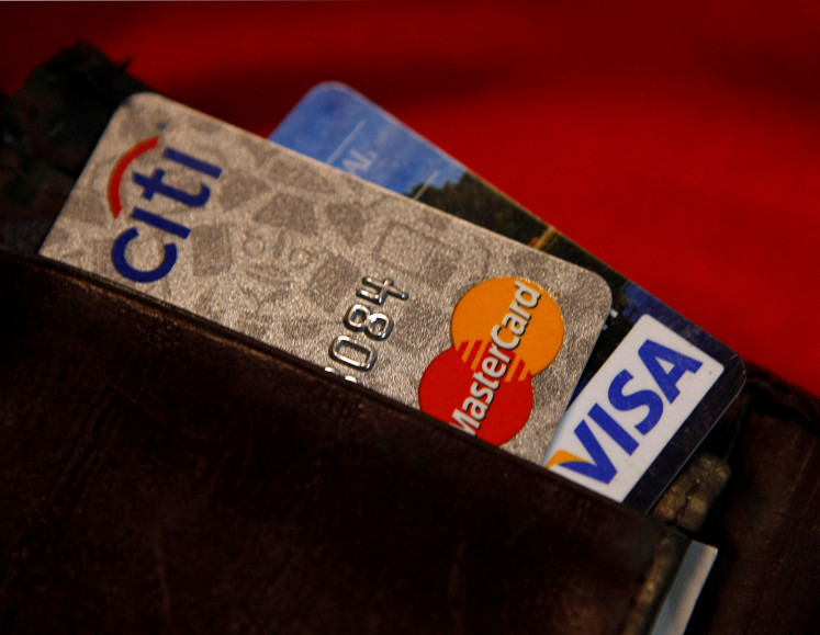 Credit cards are pictured in a wallet in Washington, DC, on Feb. 21, 2010.
