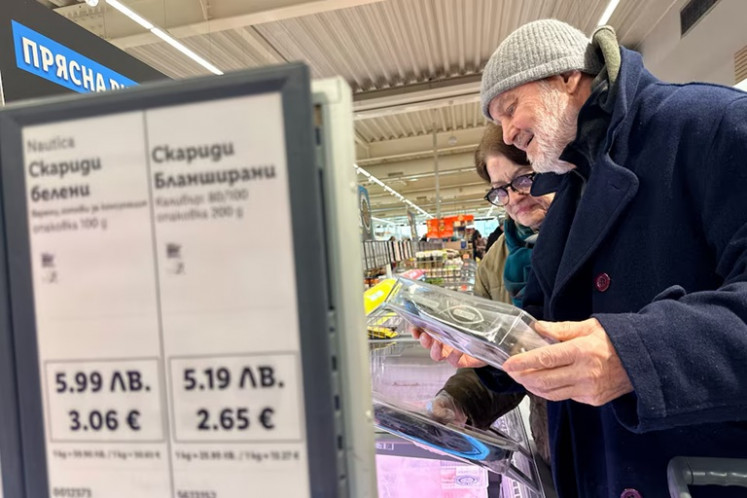 People shop inside a Lidl store in Sofia on Dec.18, 2025, as prices are displayed in both the Bulgarian lev and euro currencies, ahead of Bulgaria's adoption of the euro on Jan. 1, 2026.