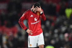 Manchester United's Portuguese midfielder #08 Bruno Fernandes reacts to their defeat on the pitch after the English FA Cup third round football match between Manchester United and Brighton and Hove Albion at Old Trafford Stadium in Manchester, north west England, on January 11, 2026. 