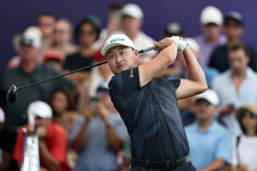 China's Li Haotong plays a shot on day four of the DP World Tour Championship 2025 at on Nov. 16, 2025, Jumeirah Golf Estates in Dubai, United Arab Emirates.