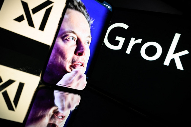 Screens display the logo of Grok, a generative artificial intelligence chatbot developed by xAI, the American company specializing in artificial intelligence and its founder South African businessman Elon Musk on Jan. 13, 2025,  in Toulouse, France.