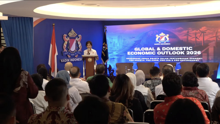 Aviliani (left rear, at podium), deputy chair of macro- and microeconomic policy analysis at the Indonesian Chamber of Commerce and Industry (Kadin), speaks on Jan. 15 at the Kadin Global and Domestic Economic Outlook 2026, themed &ldquo;Strengthening the Role of the Private Sector in Economic Growth: Pro-Growth, pro-poor, pro-job and pro-environment&rdquo;, at Menara Kadin in Kuningan, South Jakarta.