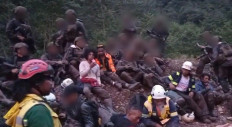Gold and copper producer PT Freeport Indonesia workers take a rest after being rescued by soldiers from the Indonesian Military's (TNI) Operation Comand (Koops) Habema at Tower Post 270 in Timika regency, Central Papua, this pictured issued on Jan. 12, 2026, by TNI headquarters. The workers were trapped for three days due to security threats by the Free Papua Organization (OPM) armed group before being rescued on Jan. 10, 2026. 