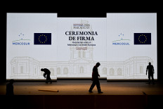 Workers set up the stage for the signing ceremony of the agreement between the European Union and Mercosur at the Gran Teatro Jose Asuncion Flores of Paraguay's Central Bank in Asuncion on January 16, 2026. The South American bloc Mercosur and the European Union will sign a deal on Jan. 17, 2026, 25 years in the making, to create one of the world's biggest free trade areas at a time of growing protectionism and volatility.