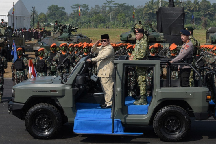 President Prabowo Subianto (left) inspects troops from a vehicle during the Operational Troops and Military Honours ceremony as he inaugurates commanders of Special Forces Command (Kopassus), Marine Corps, and Air Force Quick Reaction Command (Kopasgat) at Suparlan Airfield, in Bandung, West Java, August 10, 2025. 