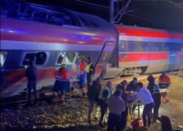 This video grab taken from UGC images posted on social media and verified by AFPTV teams in Madrid, shows emergency personnel working after a train accident in Adamuz, southern Spain, on January 18, 2026. At least 21 people died in a train accident near Adamuz, in the Spanish province of Cordoba (south), when a train derailed and collided with another convoy traveling on the opposite track,. A train from the Spanish company Iryo traveling from the Andalusian city of Malaga to Madrid 'derailed' near Adamuz, stated the Railway Infrastructure Administrator (Adif), a public entity under the Ministry of Transport, on X. 