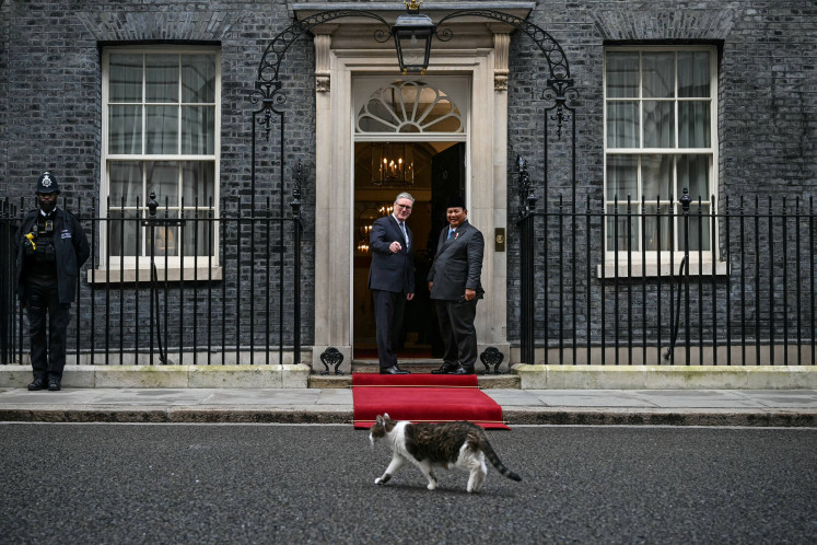 Larry the Cat walks past as British Prime Minister Keir Starmer welcomes Indonesia's President Prabowo Subianto in Downing Street for their meeting in central London, on January 20, 2026.     