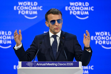 France's President Emmanuel Macron gestures as he delivers a speech during the World Economic Forum (WEF) annual meeting in Davos on January 20, 2026. The World Economic Forum takes place in Davos from January 19 to January 23, 2026.
